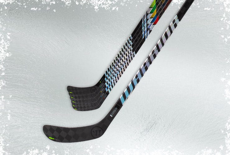 Warrior ALpha LX2 Pro hockey sticks on an icy background