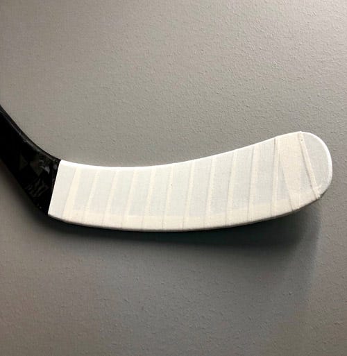 Why Tape a Hockey Stick: Enhance Grip and Performance